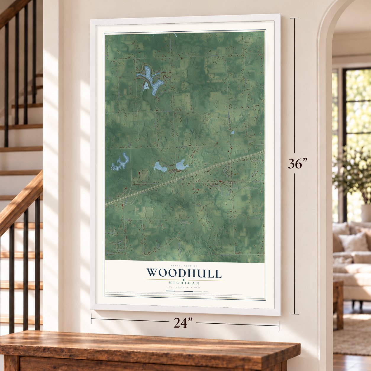 Woodhull, Michigan map, 24 x 36 inch print in a white frame by a staircase