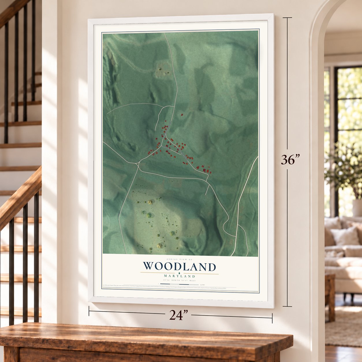 Woodland, Maryland map, 24 x 36 inch print in a white frame by a staircase