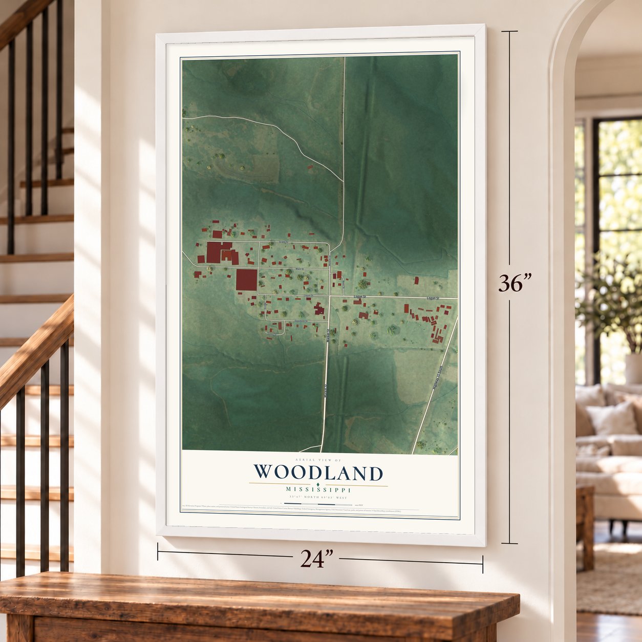 Woodland, Mississippi map, 24 x 36 inch print in a white frame by a staircase