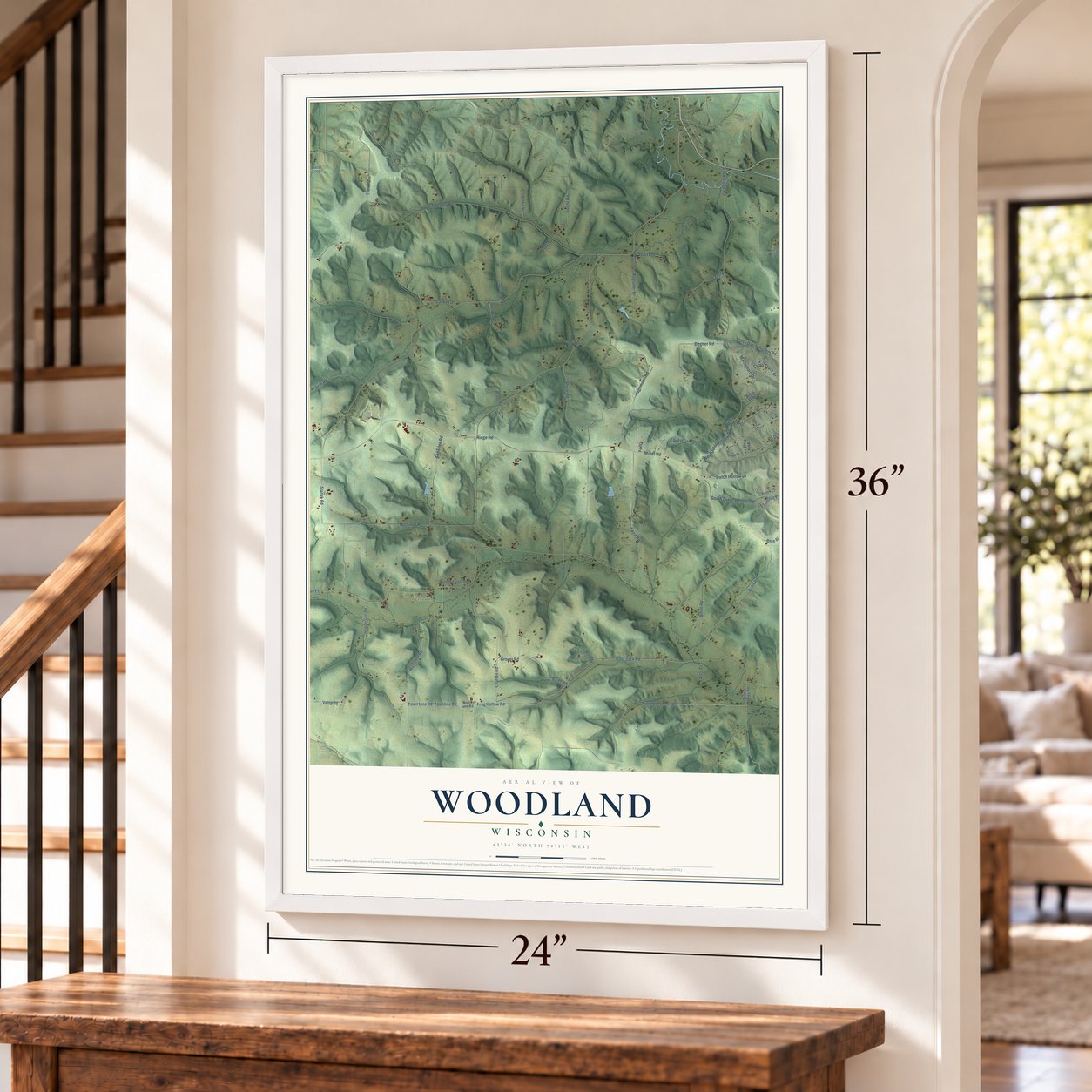 Woodland, Wisconsin map, 24 x 36 inch print in a white frame by a staircase