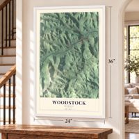 Woodstock, Vermont map, 24 x 36 inch print in a white frame by a staircase