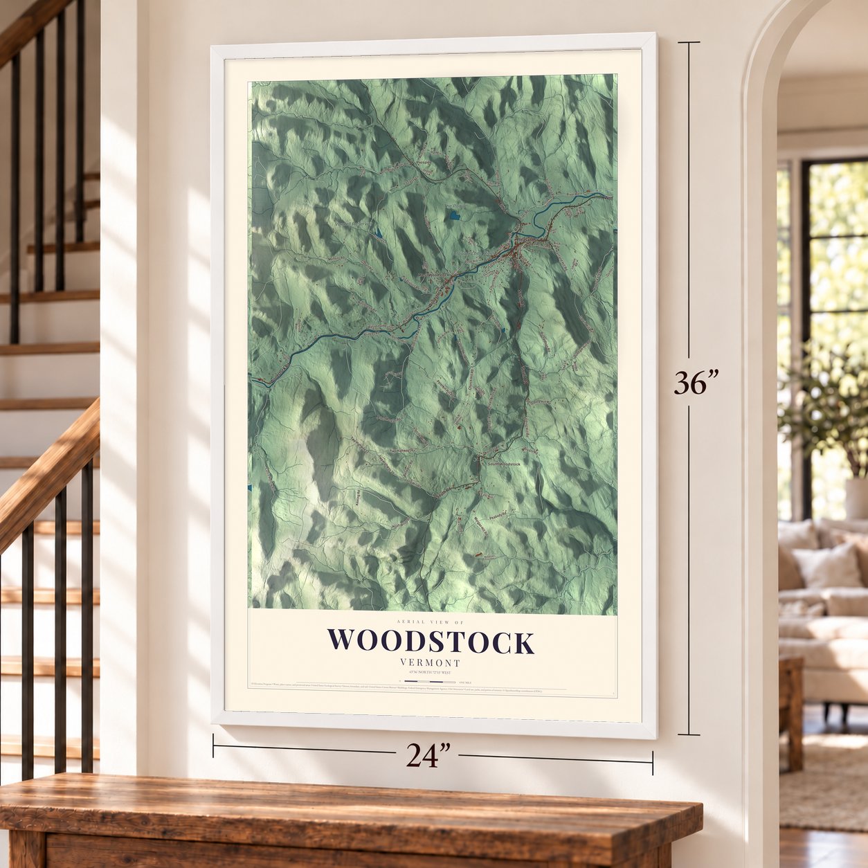 Woodstock, Vermont map, 24 x 36 inch print in a white frame by a staircase