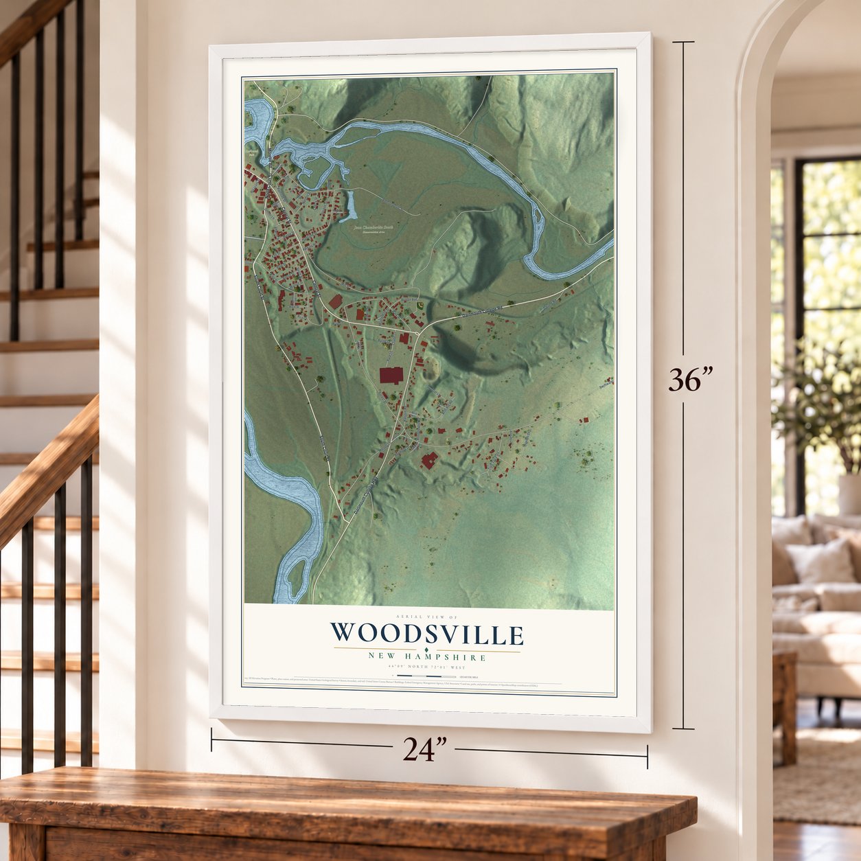 Woodsville, New Hampshire map, 24 x 36 inch print in a white frame by a staircase