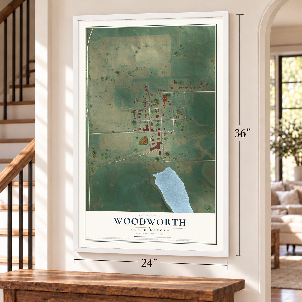 Woodworth, North Dakota map, 24 x 36 inch print in a white frame by a staircase