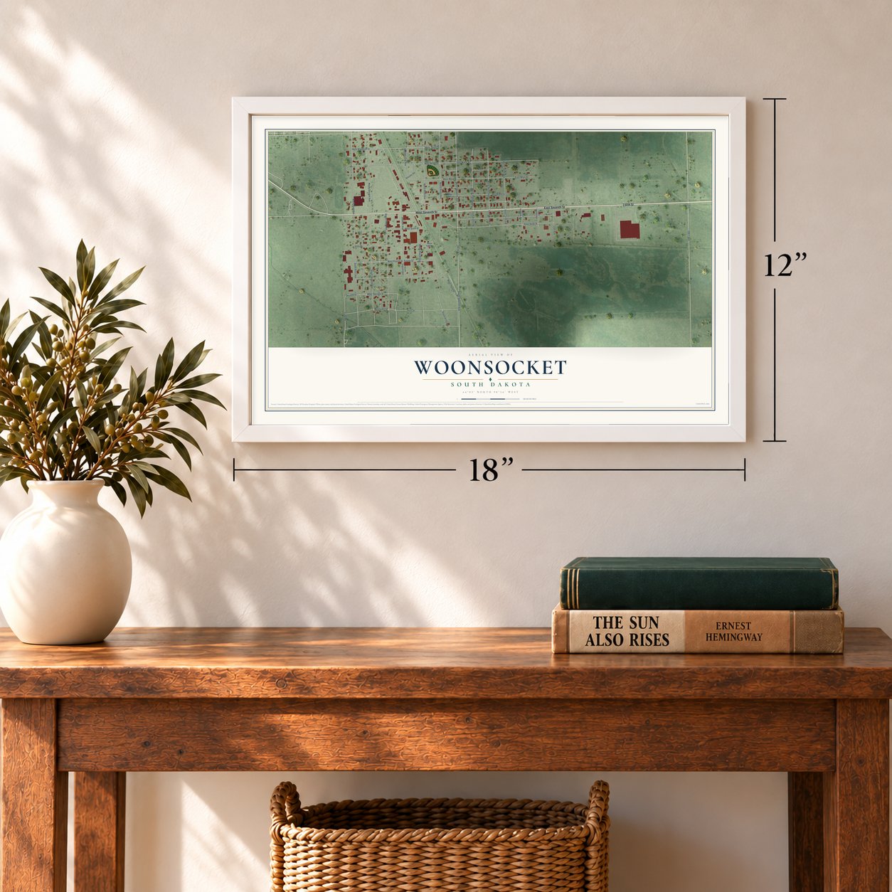 Woonsocket, South Dakota map, 12 x 18 inch print in a white frame in an entryway