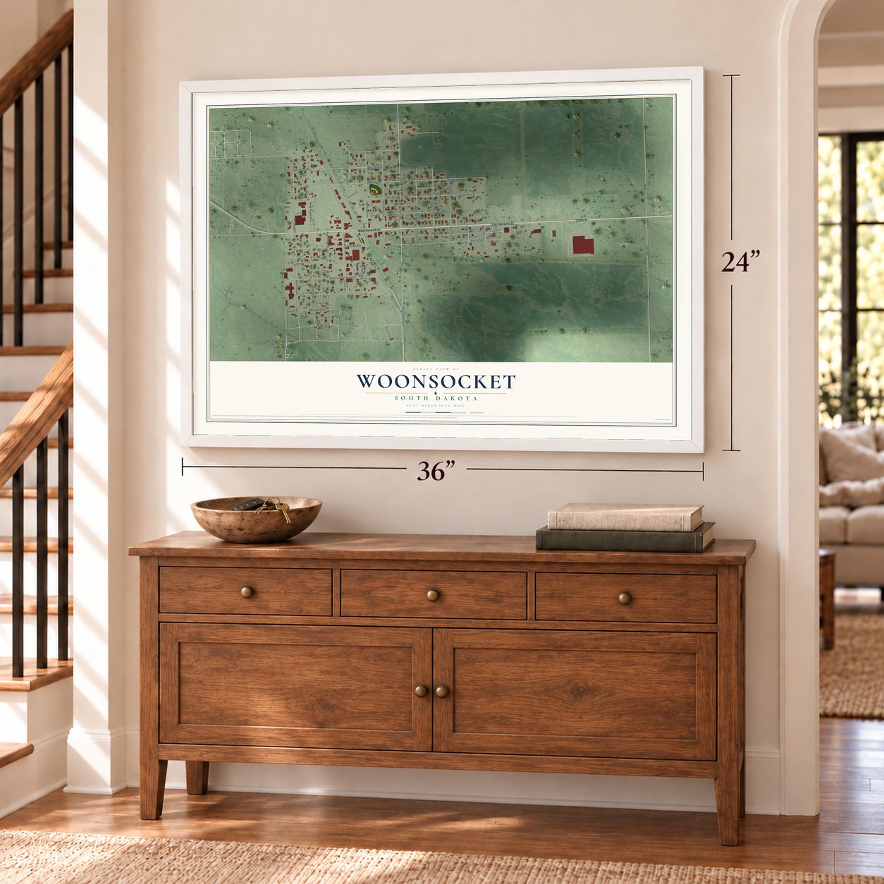 Woonsocket, South Dakota map, 24 x 36 inch print in a white frame above a dresser by a staircase