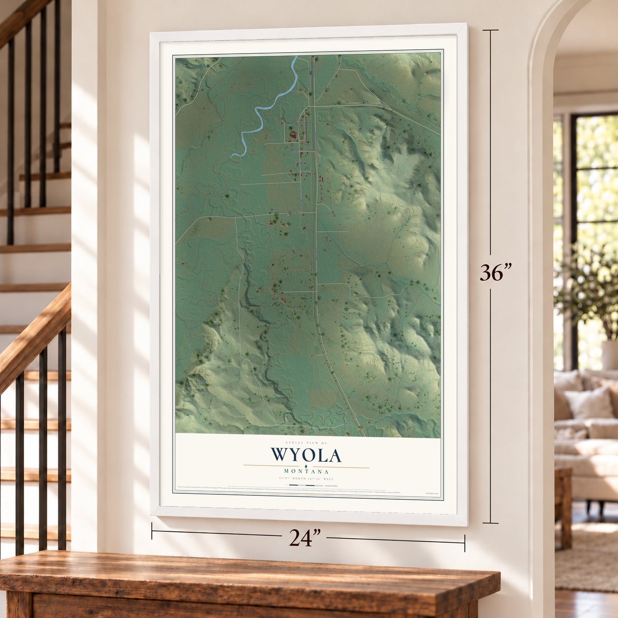 Wyola, Montana map, 24 x 36 inch print in a white frame by a staircase