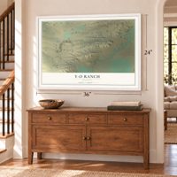 Y-O Ranch, Wyoming map, 24 x 36 inch print in a white frame above a dresser by a staircase