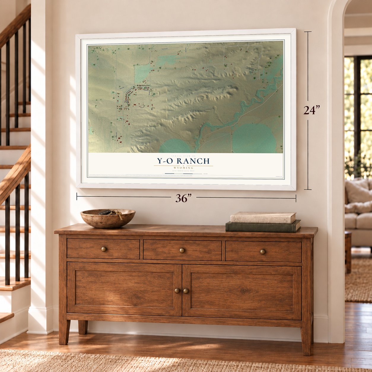 Y-O Ranch, Wyoming map, 24 x 36 inch print in a white frame above a dresser by a staircase
