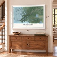 Yankeetown, Florida map, 24 x 36 inch print in a white frame above a dresser by a staircase