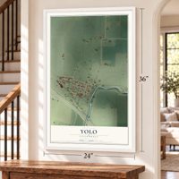 Yolo, California map, 24 x 36 inch print in a white frame by a staircase