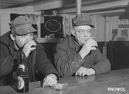Shipyard workers stop in for a beer after work.