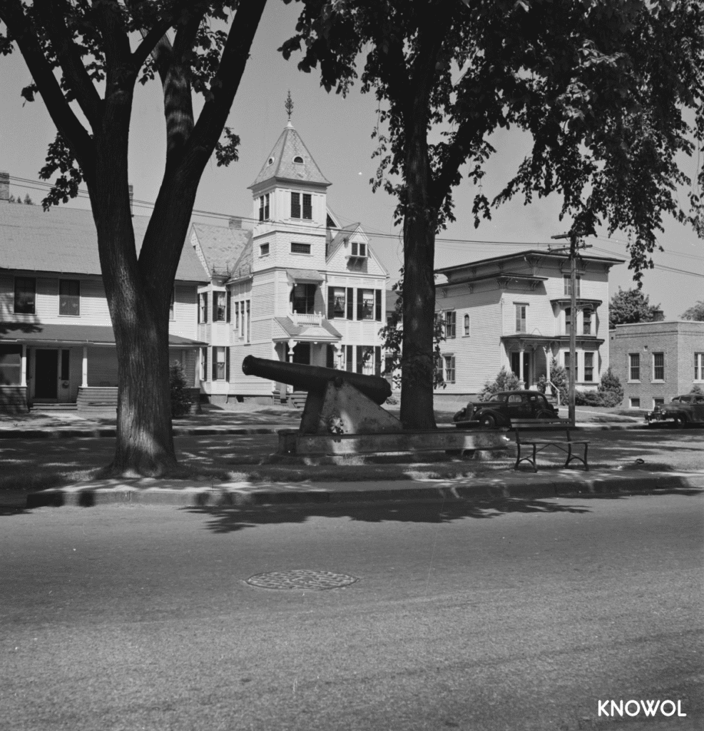 A view of a civil war cannon on the town green.