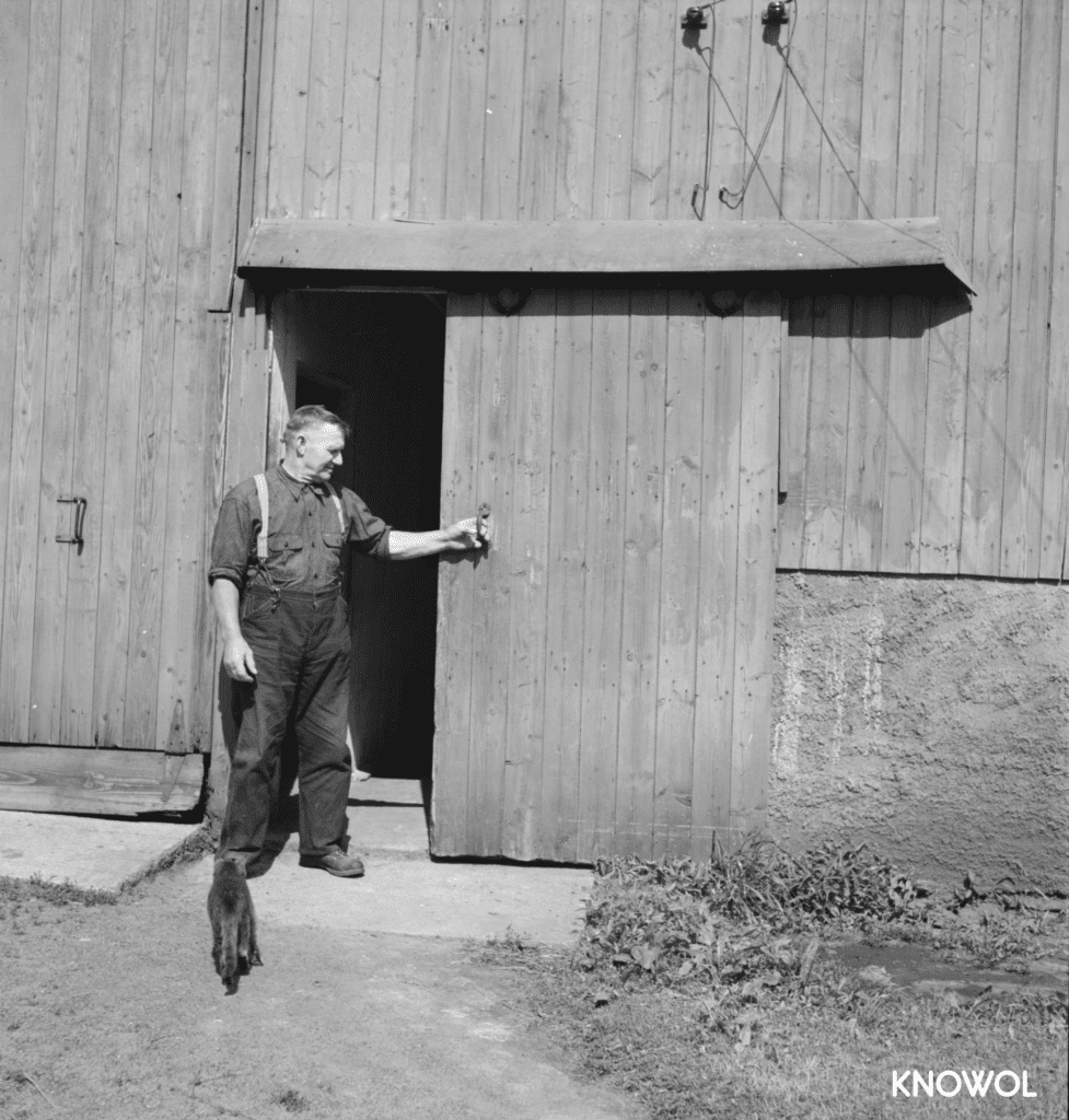 Andrew Smedberg came to America in 1920 from Sweden, and is seen here with his farm cat.
