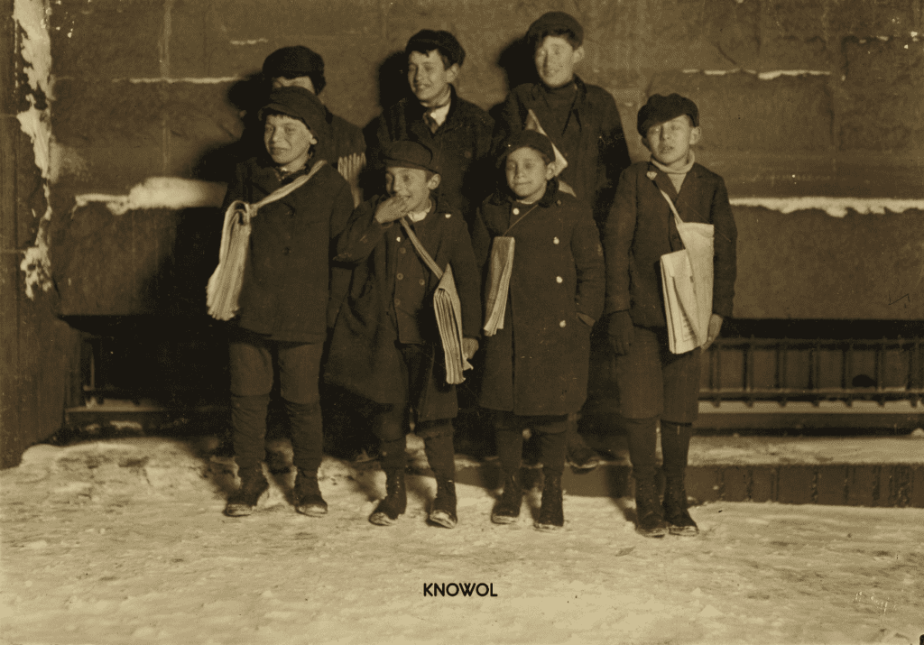 A group of newsies selling newspapers at 9PM although it was bitter cold and snowing.