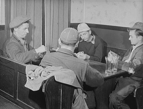 Four men enjoying a game of cards in Art's Sportsman's Tavern.