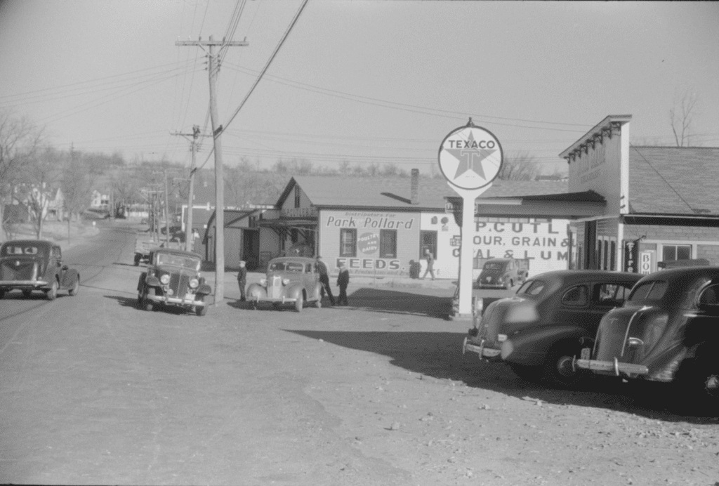 This street housed a series of stores selling animal feed, grains, gasoline, and ladies coats.