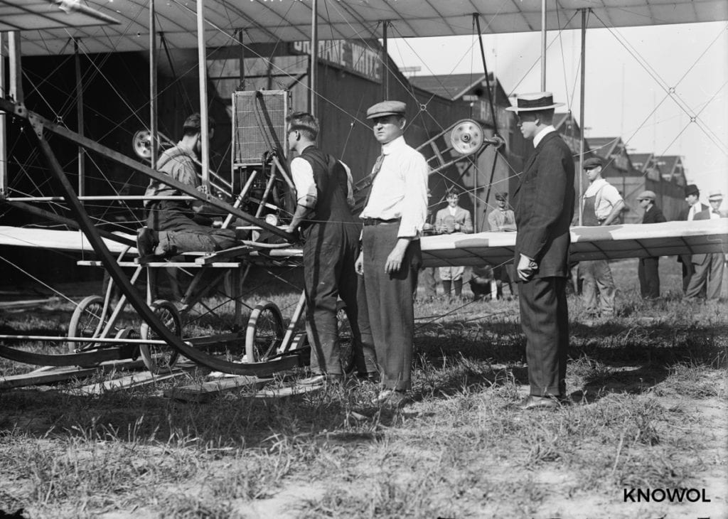 Men looking at an airplane in Garden City, NY in 1911