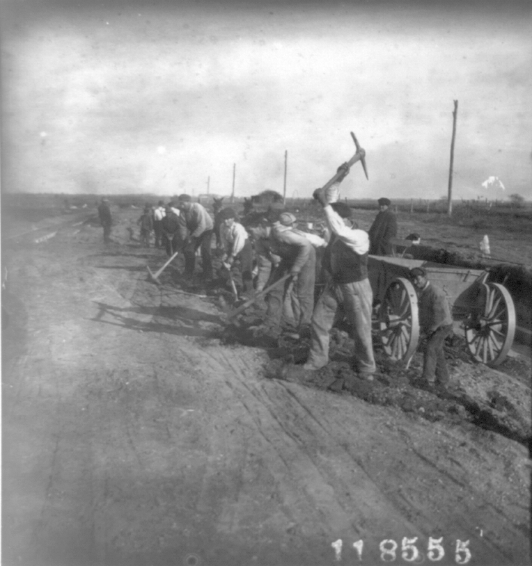 This picture of Garden City NY shows laborers excavating for laying out streets, in 1911.