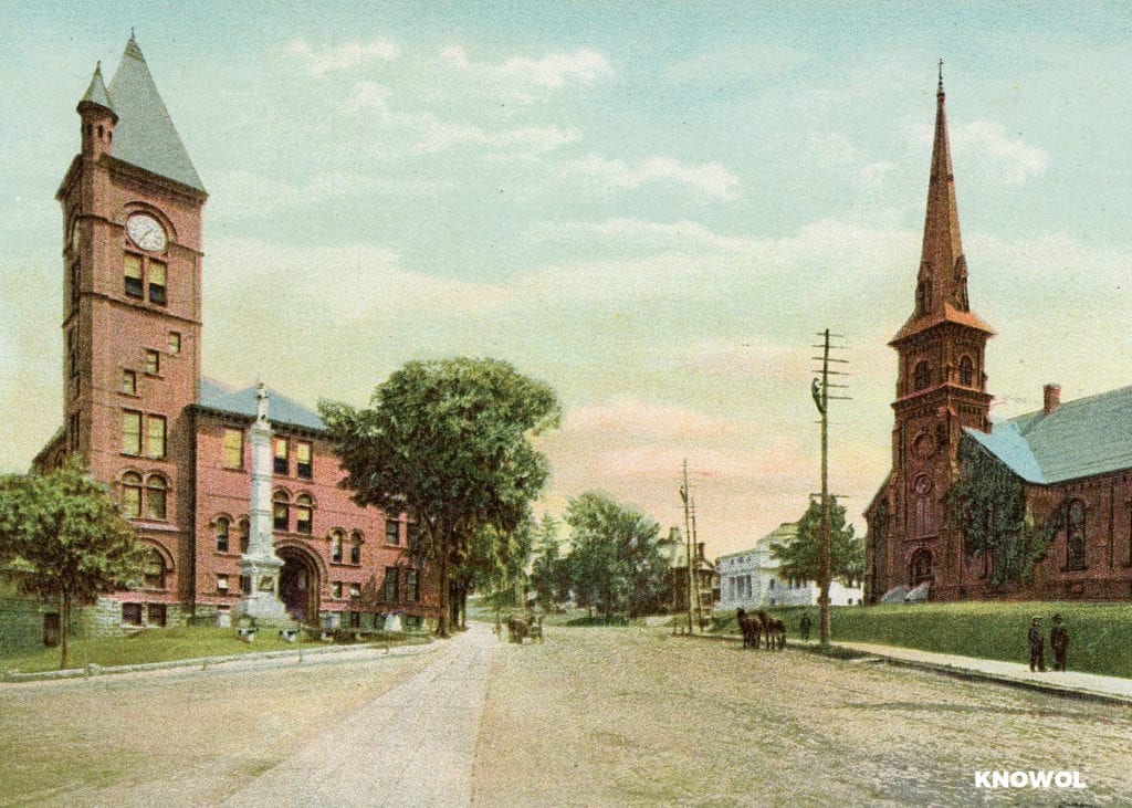 The First Methodist church can be seen to the right, and City Hall is on the left.