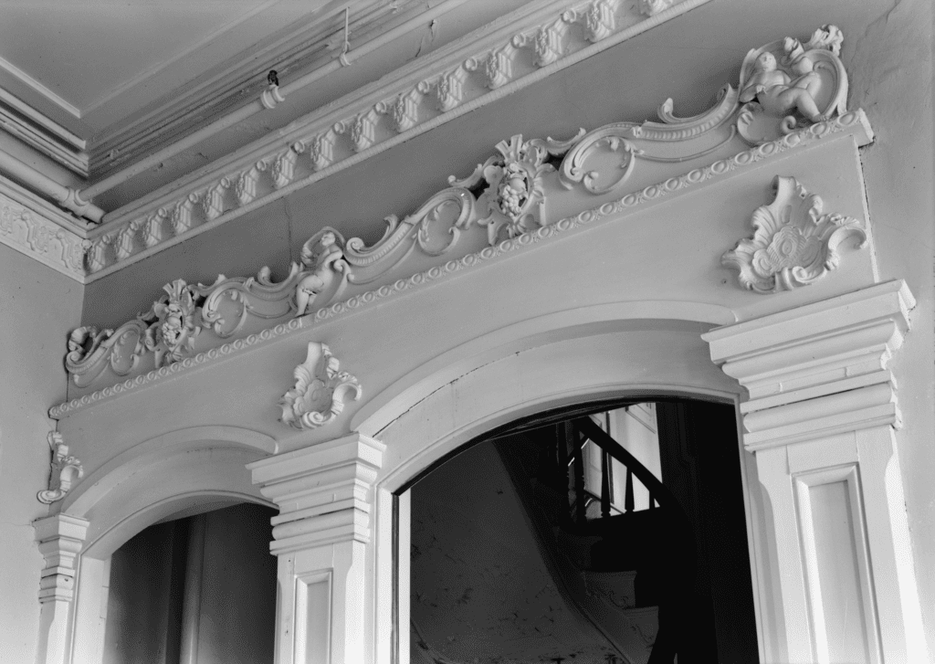 Everything in the house was finely crafted, from the archways to the winding staircase seen in the background.