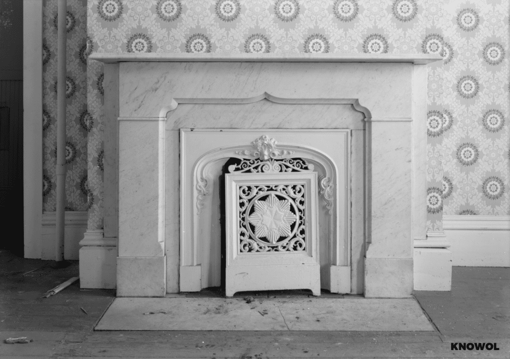 The home was built with high quality materials, including this marble fireplace that was hopefully saved or preserved.