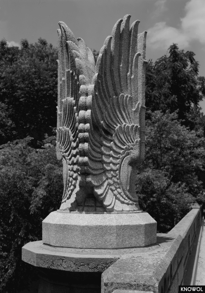 This wing sculpture sits atop the James Farm Road bridge.