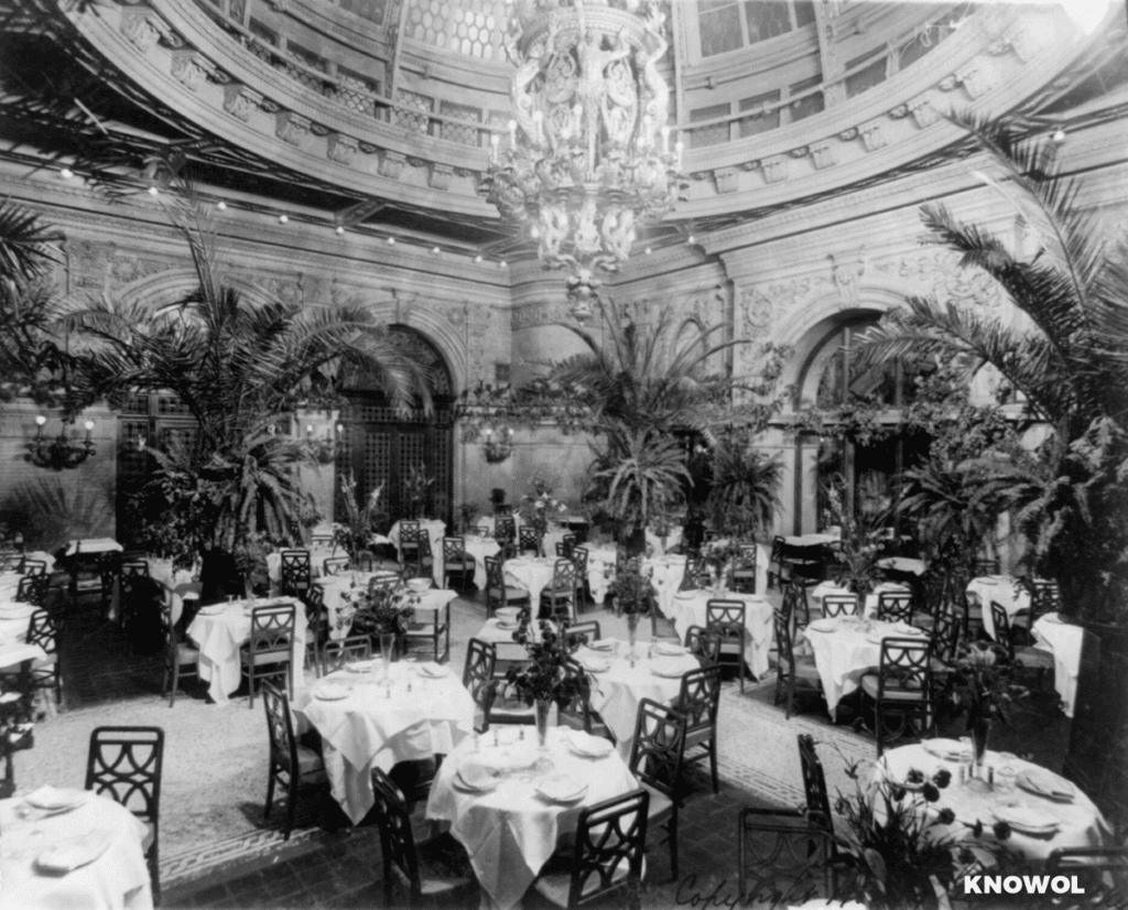 The palm gardens, used as cafes, rose to a height of two and three stories respectively and were roofed-over with domes of