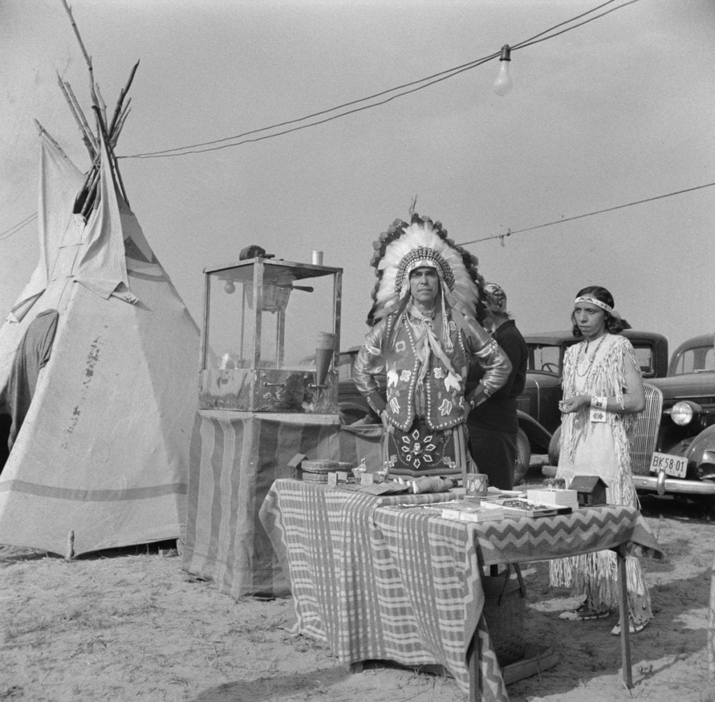 This photograph was titled This Woods Indian had a busy day selling popcorn and birch bark novelties.