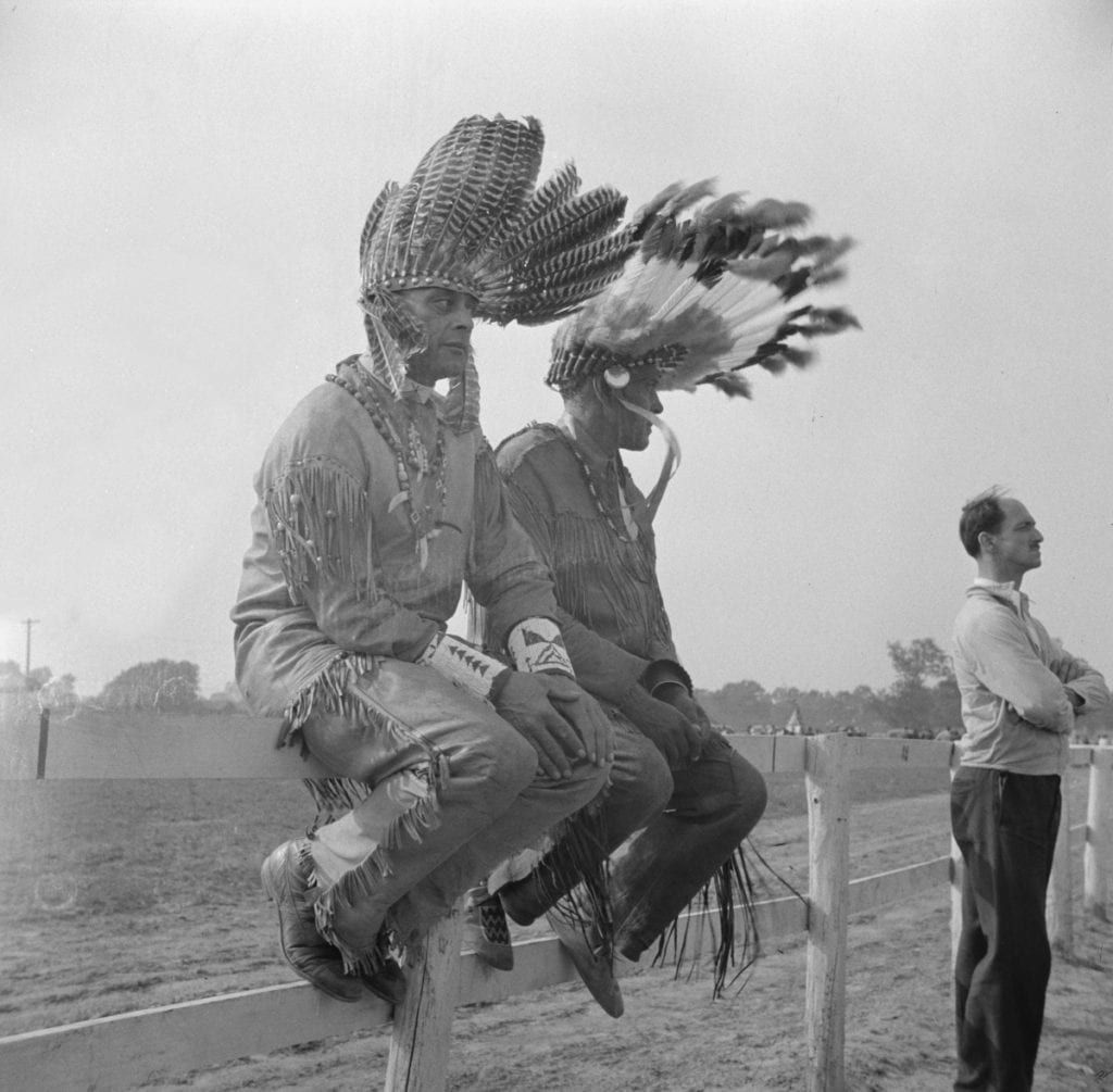 Indians catching a little rest between entertaining visitors at the locally sponsored Indian fair