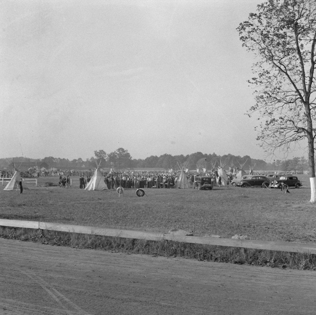 The tipi's and cars were circled around a fenced area that was used for live performances during the fair.