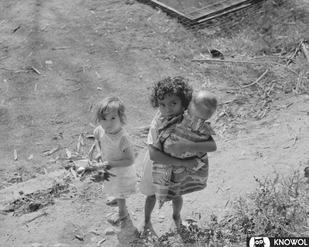 These two bayamon children are holding one of the few toys they owned.