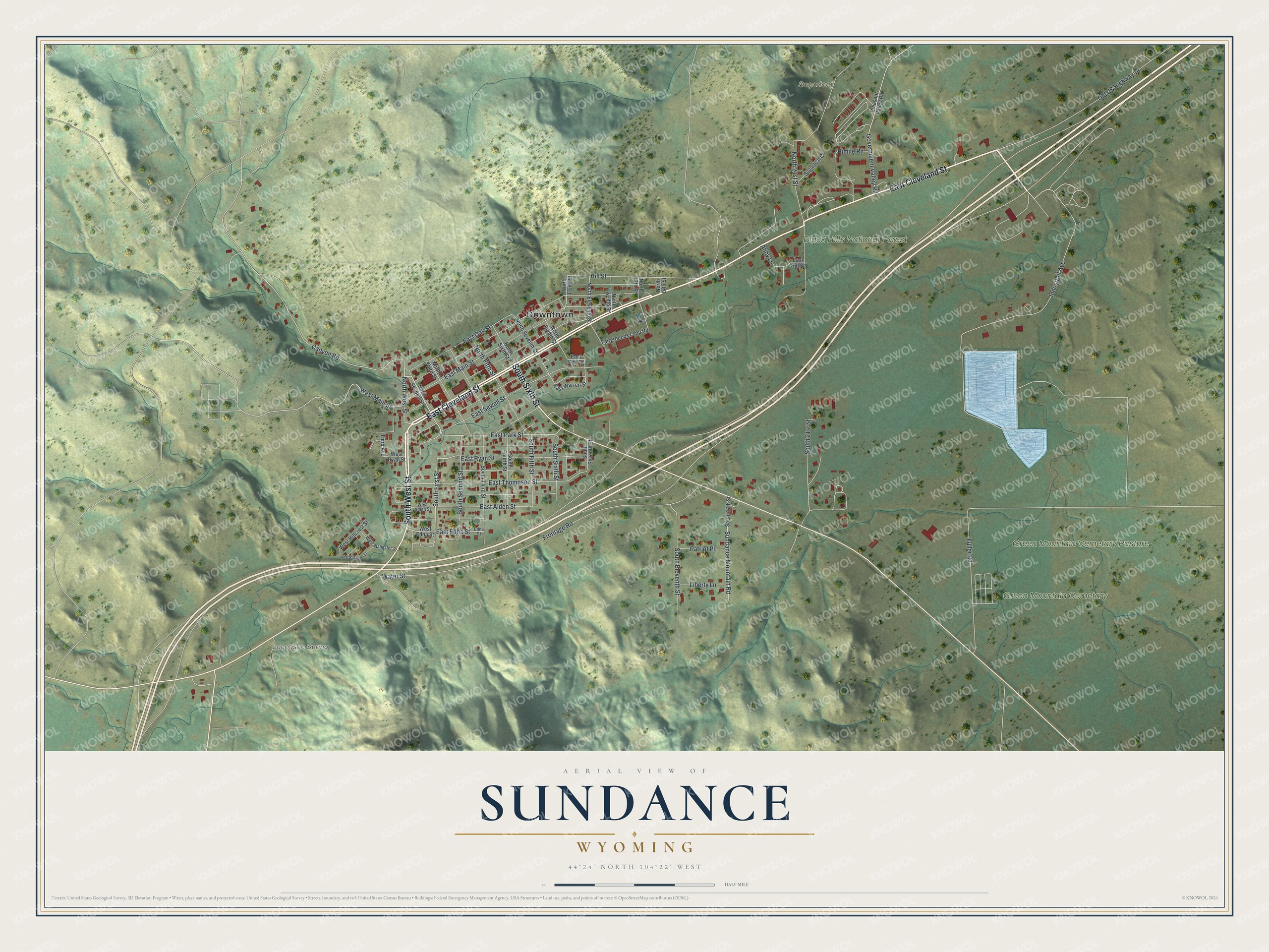 Full map of Sundance, Wyoming, with red buildings, printed street names and the land around them