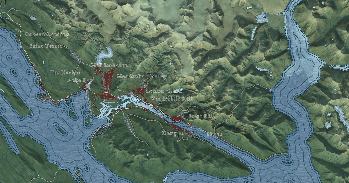 Close view of the most built-up part of Juneau, Alaska, with rows of red buildings along its streets