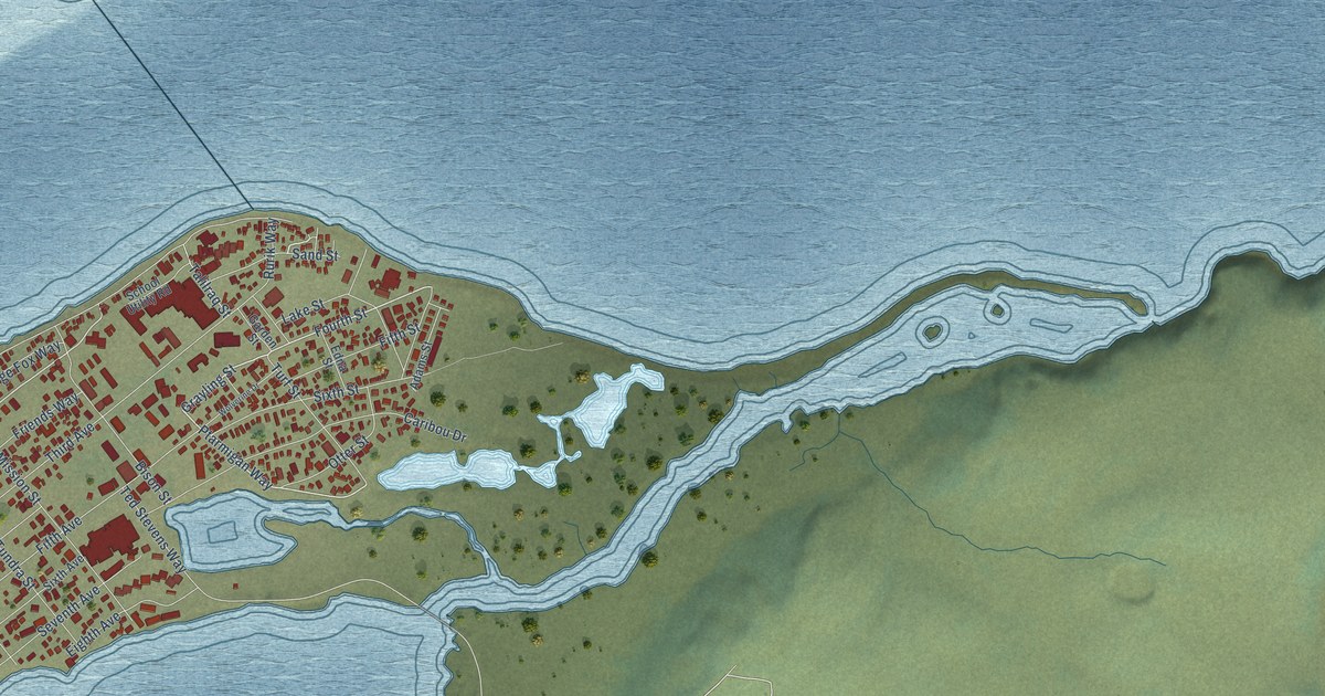 Close view of the most built-up part of Kotzebue, Alaska, with rows of red buildings along its streets