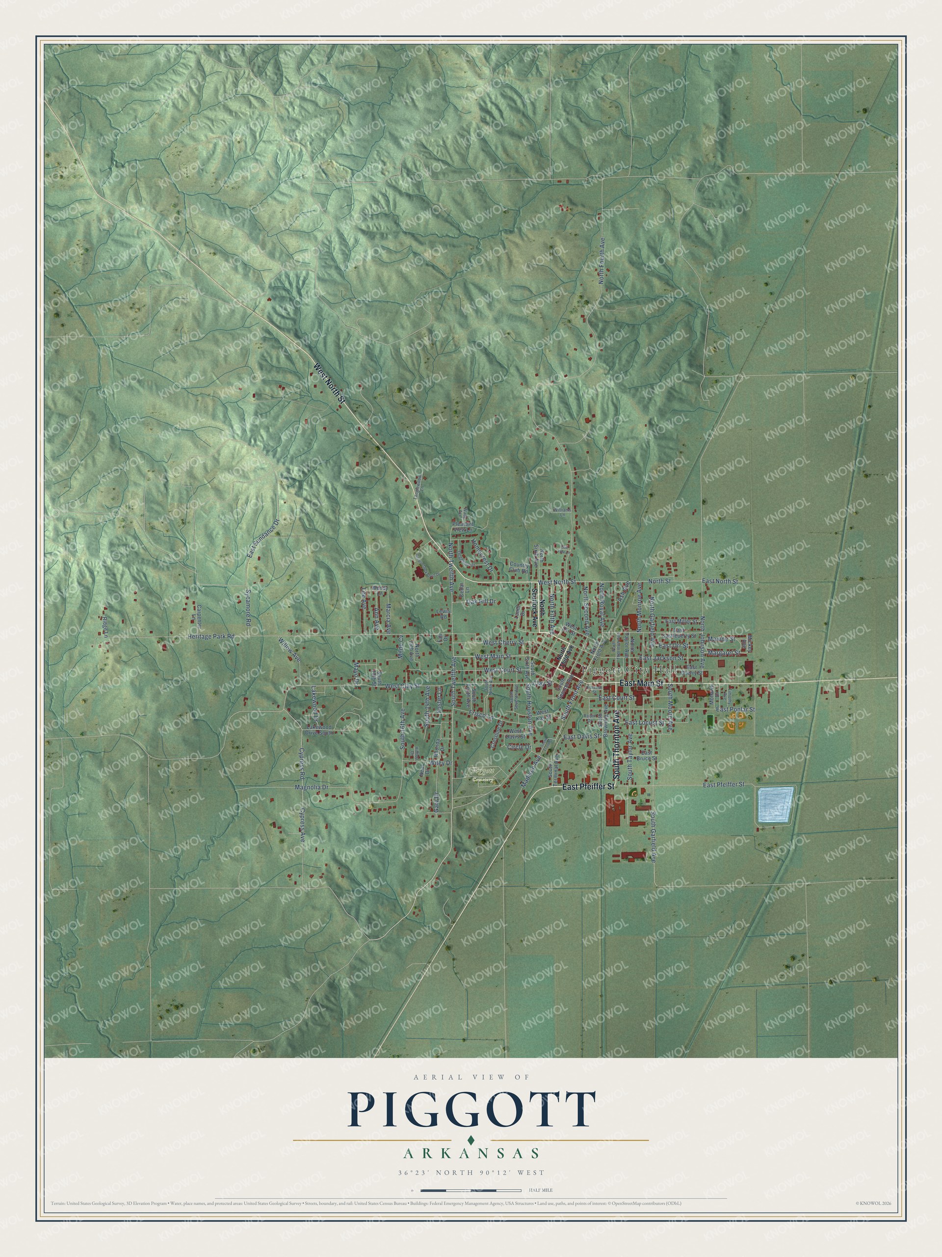 Full map of Piggott, Arkansas, with red buildings, printed street names and the land around them