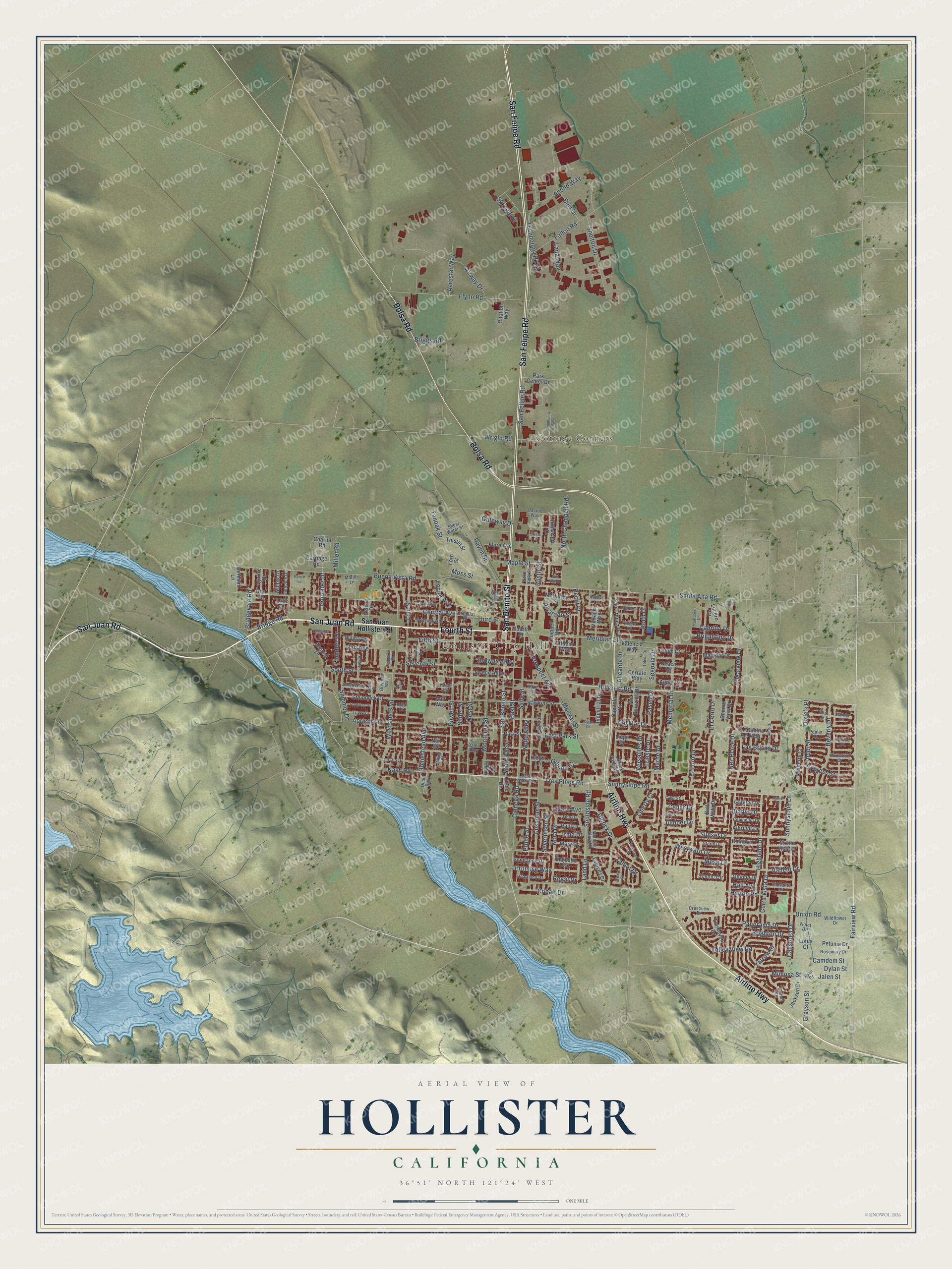 Full map of Hollister, California, with red buildings, printed street names and the land around them