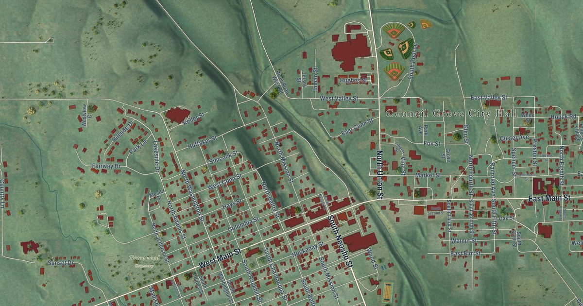 Close view of the most built-up part of Council Grove, Kansas, with rows of red buildings along its streets