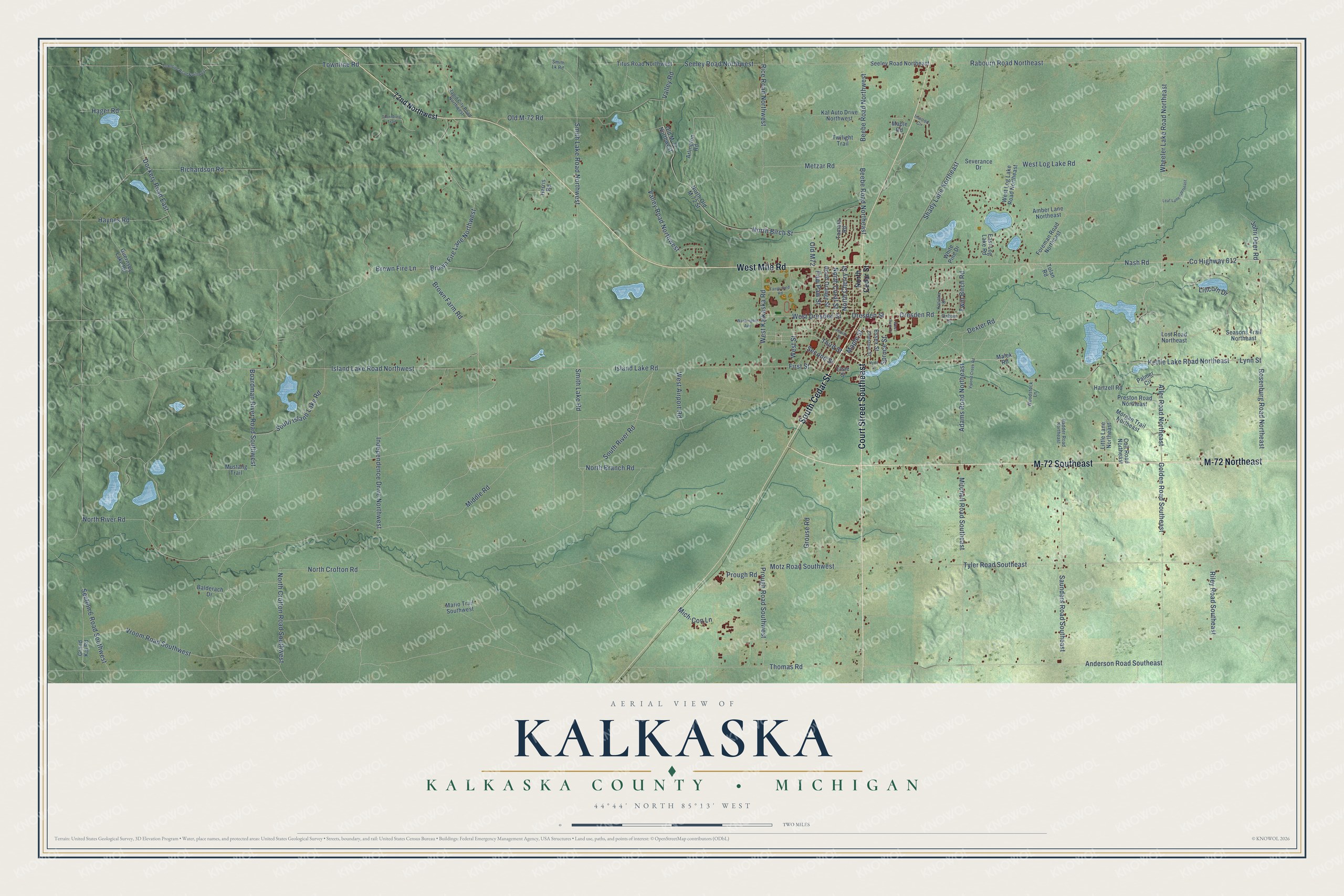 Full map of Kalkaska, Michigan, with red buildings, printed street names and the land around them