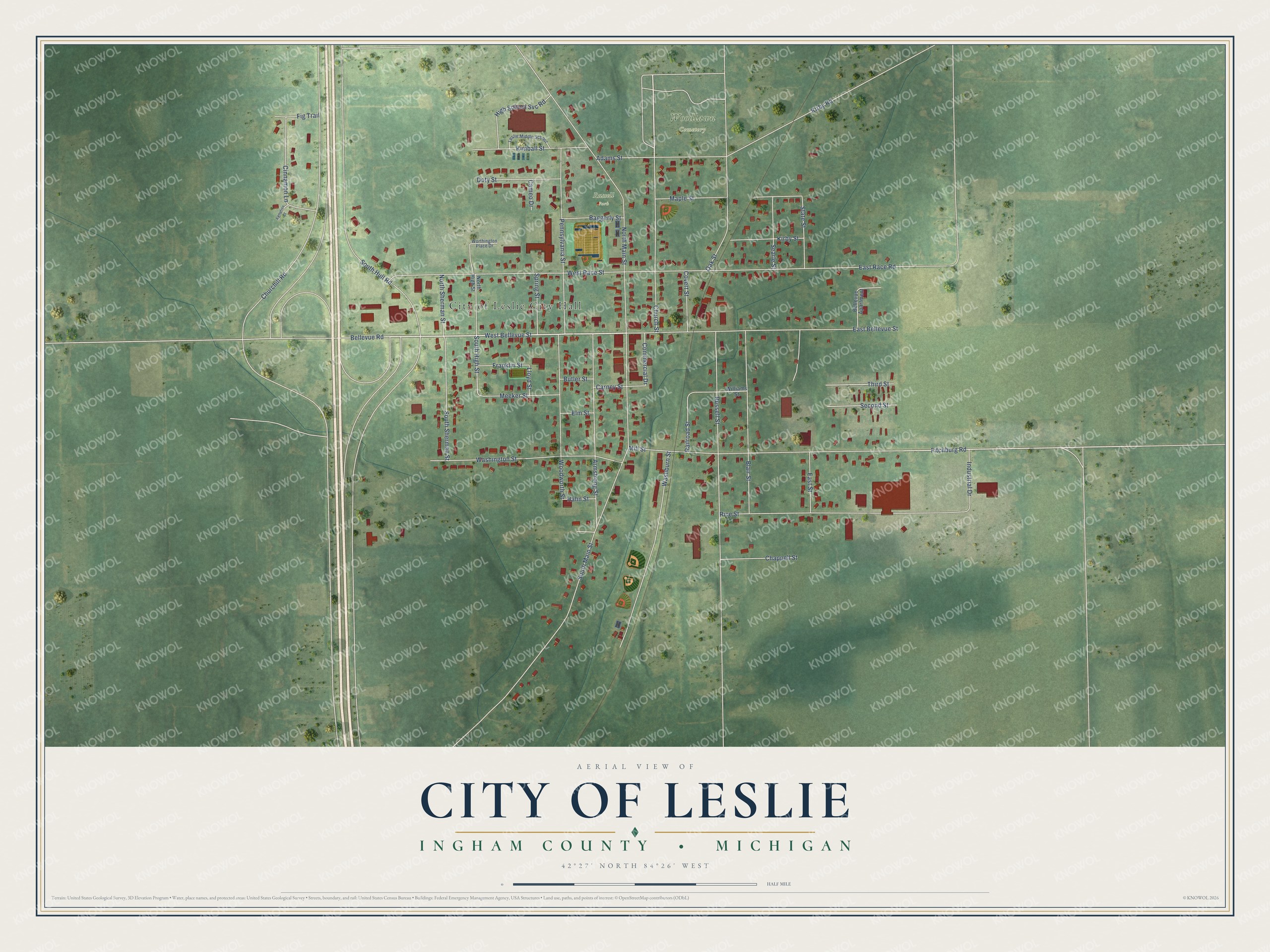 Full map of Leslie, Michigan, with red buildings, printed street names and the land around them