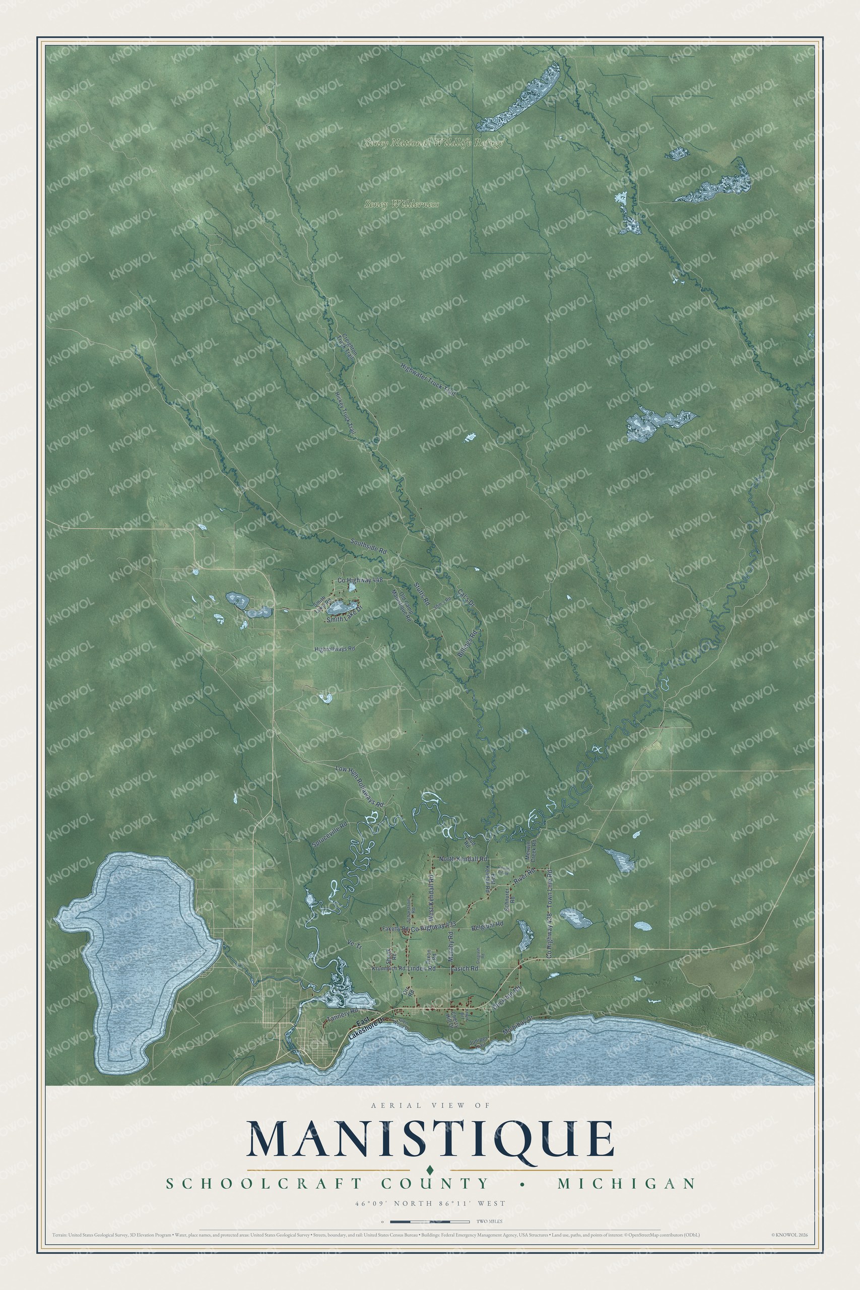 Full map of Manistique, Michigan, with red buildings, printed street names and the land around them