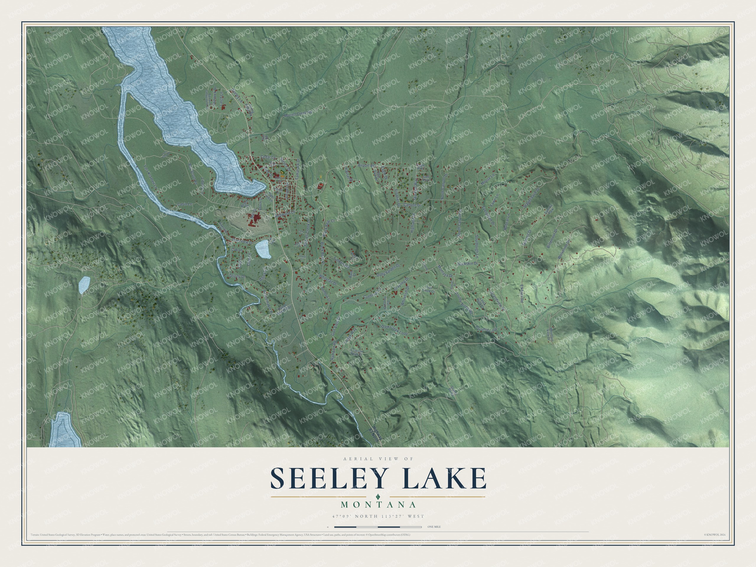 Full map of Seeley Lake, Montana, with red buildings, printed street names and the land around them