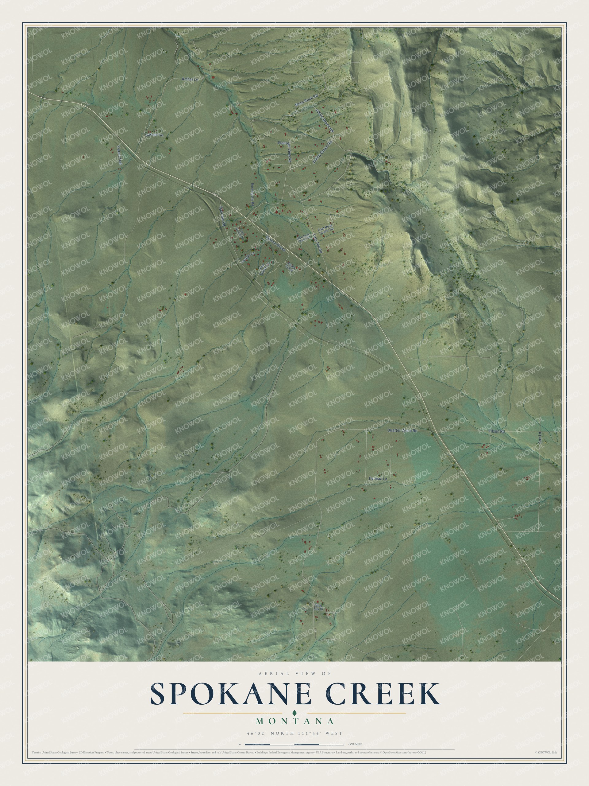 Full map of Spokane Creek, Montana, with red buildings, printed street names and the land around them