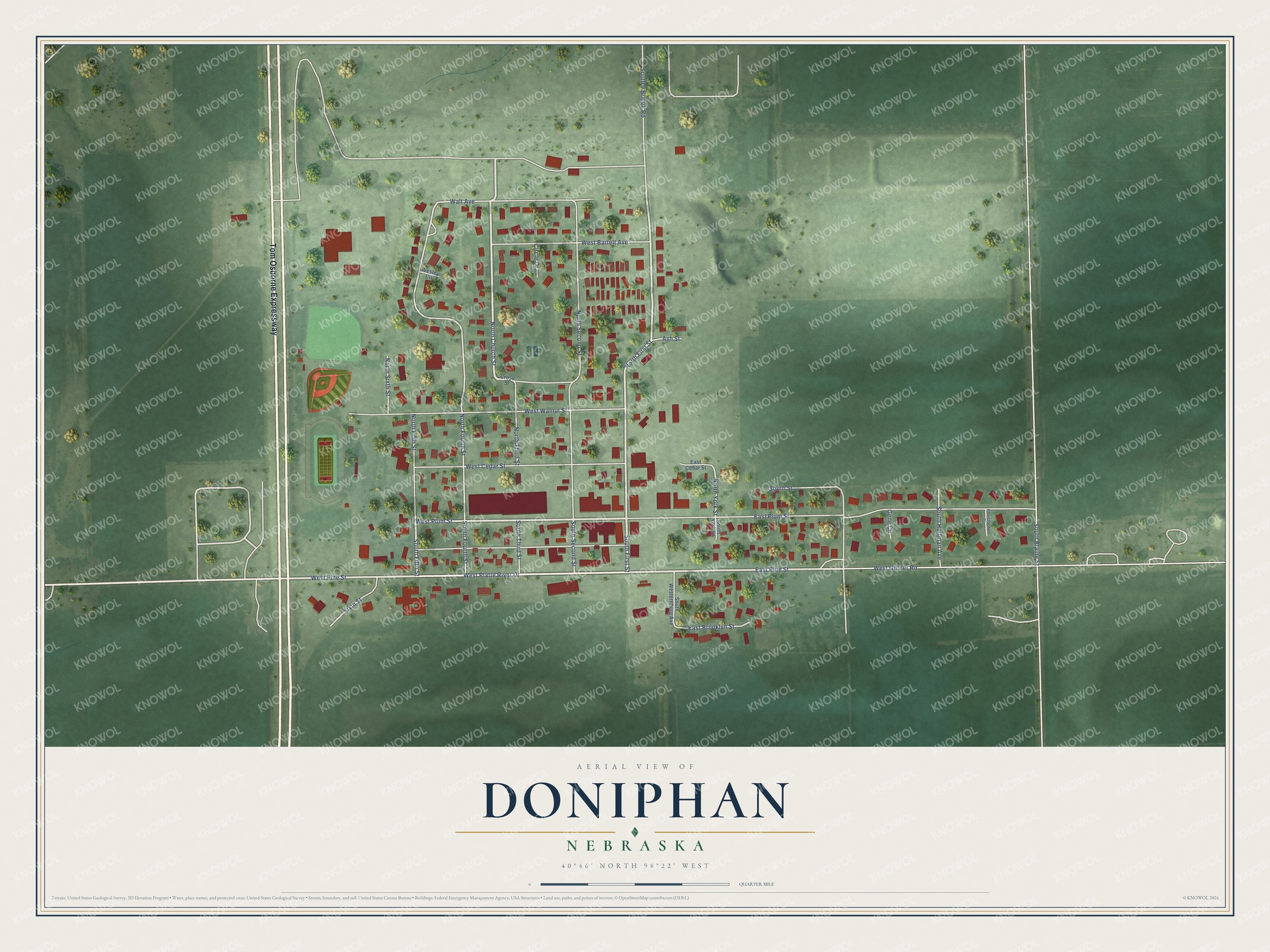 Full map of Doniphan, Nebraska, with red buildings, printed street names and the land around them