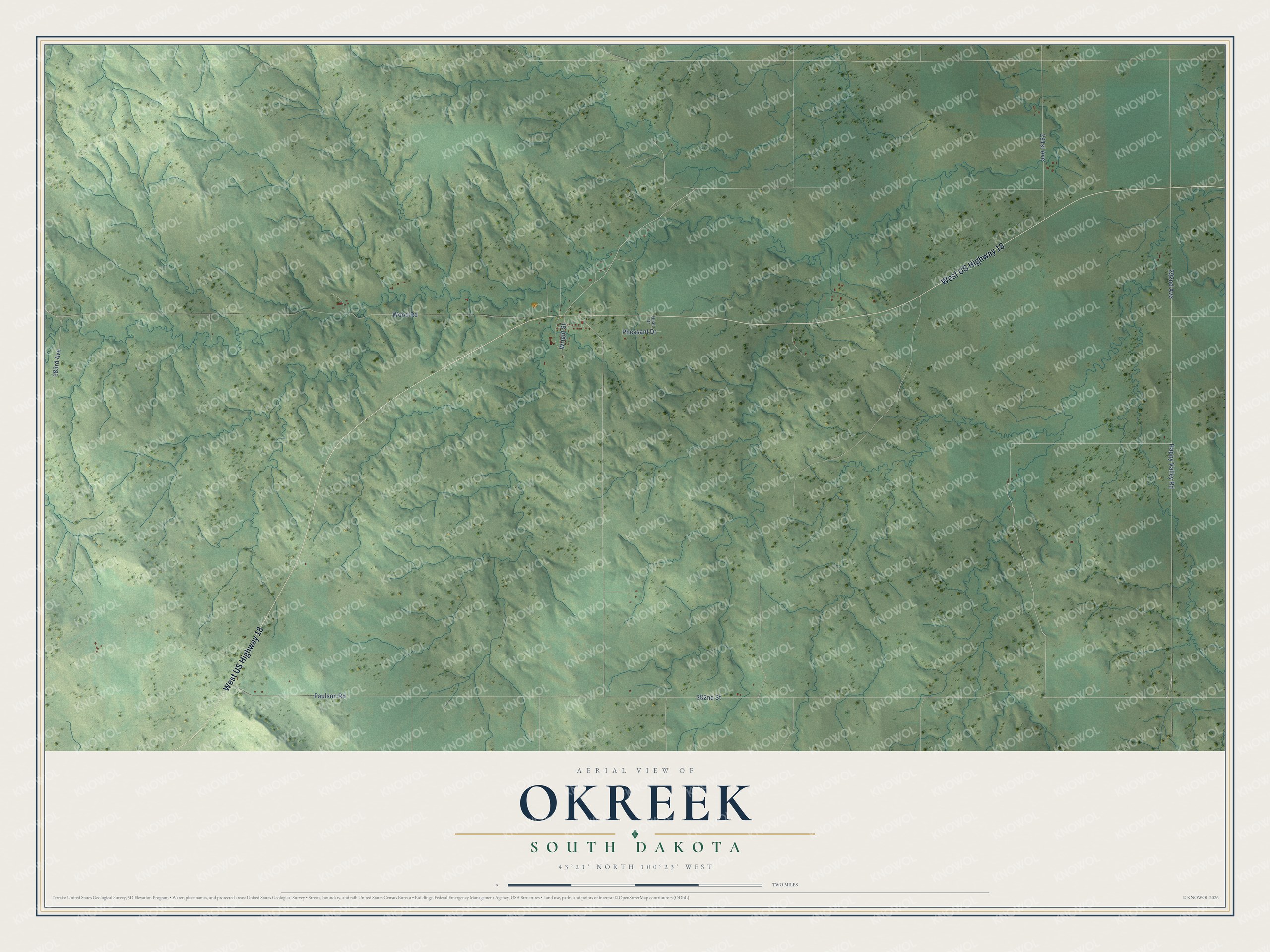 Full map of Okreek, South Dakota, with red buildings, printed street names and the land around them