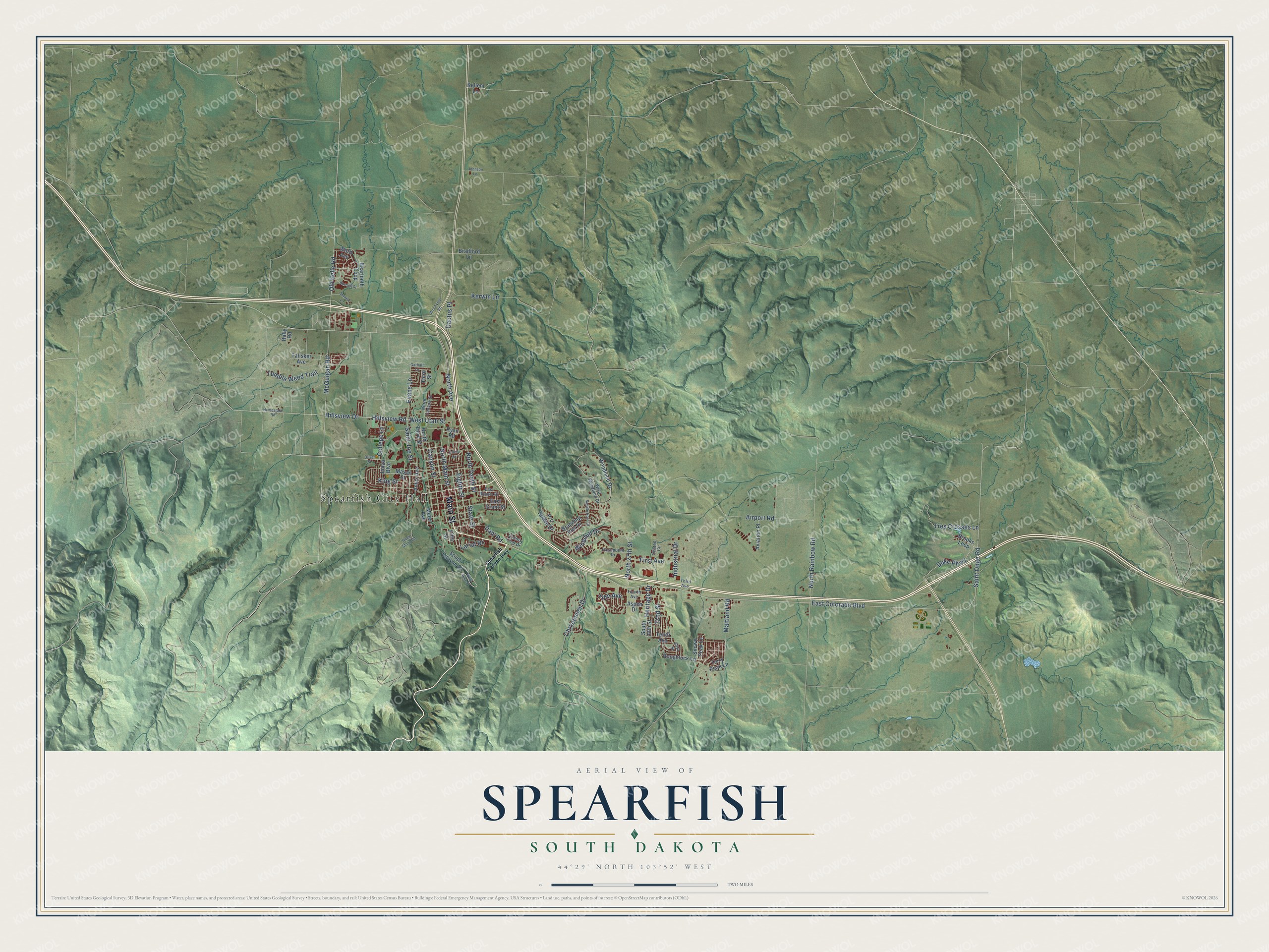 Full map of Spearfish, South Dakota, with red buildings, printed street names and the land around them