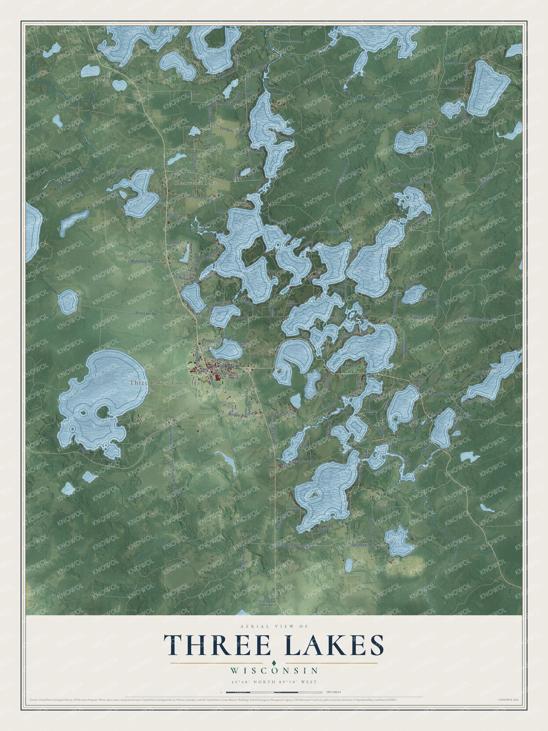 Full map of Three Lakes, Wisconsin, with red buildings, printed street names and the land around them