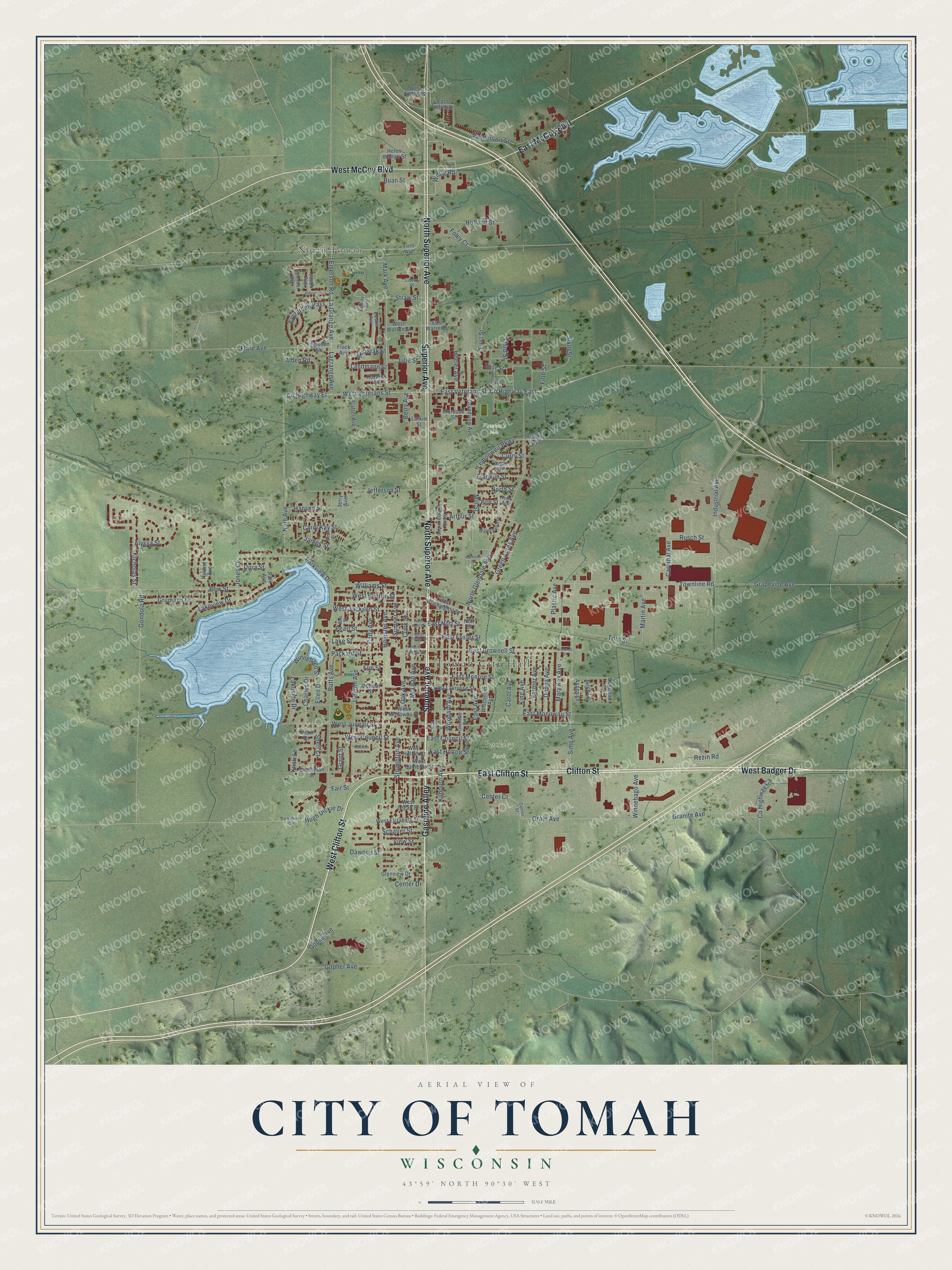 Full map of Tomah, Wisconsin, with red buildings, printed street names and the land around them