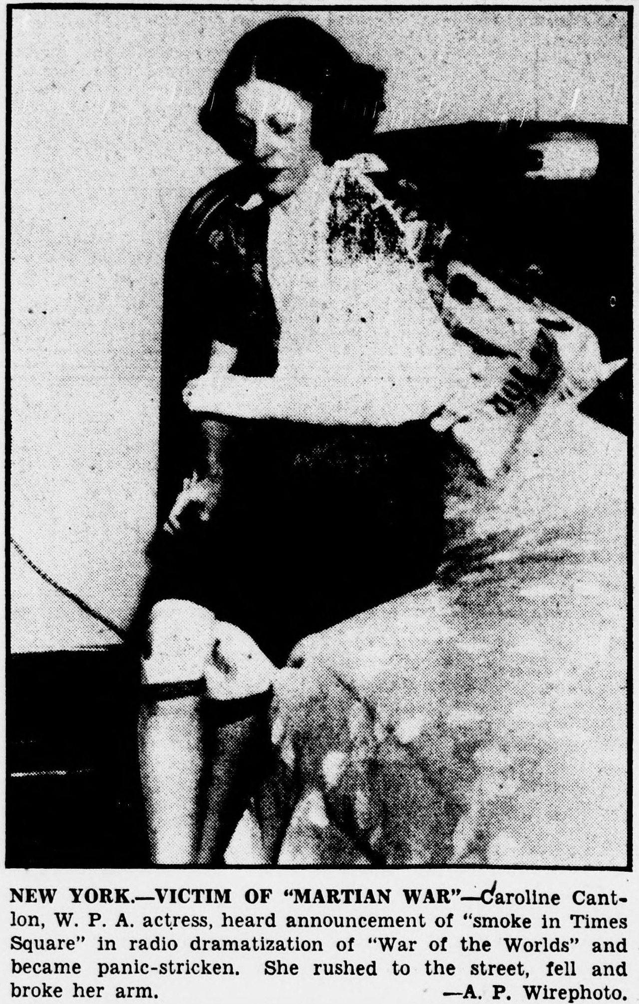 1938 newspaper photograph of Caroline Cantlon, a young woman with dark hair, sitting with one arm bandaged after she fell running into the street during the War of the Worlds broadcast